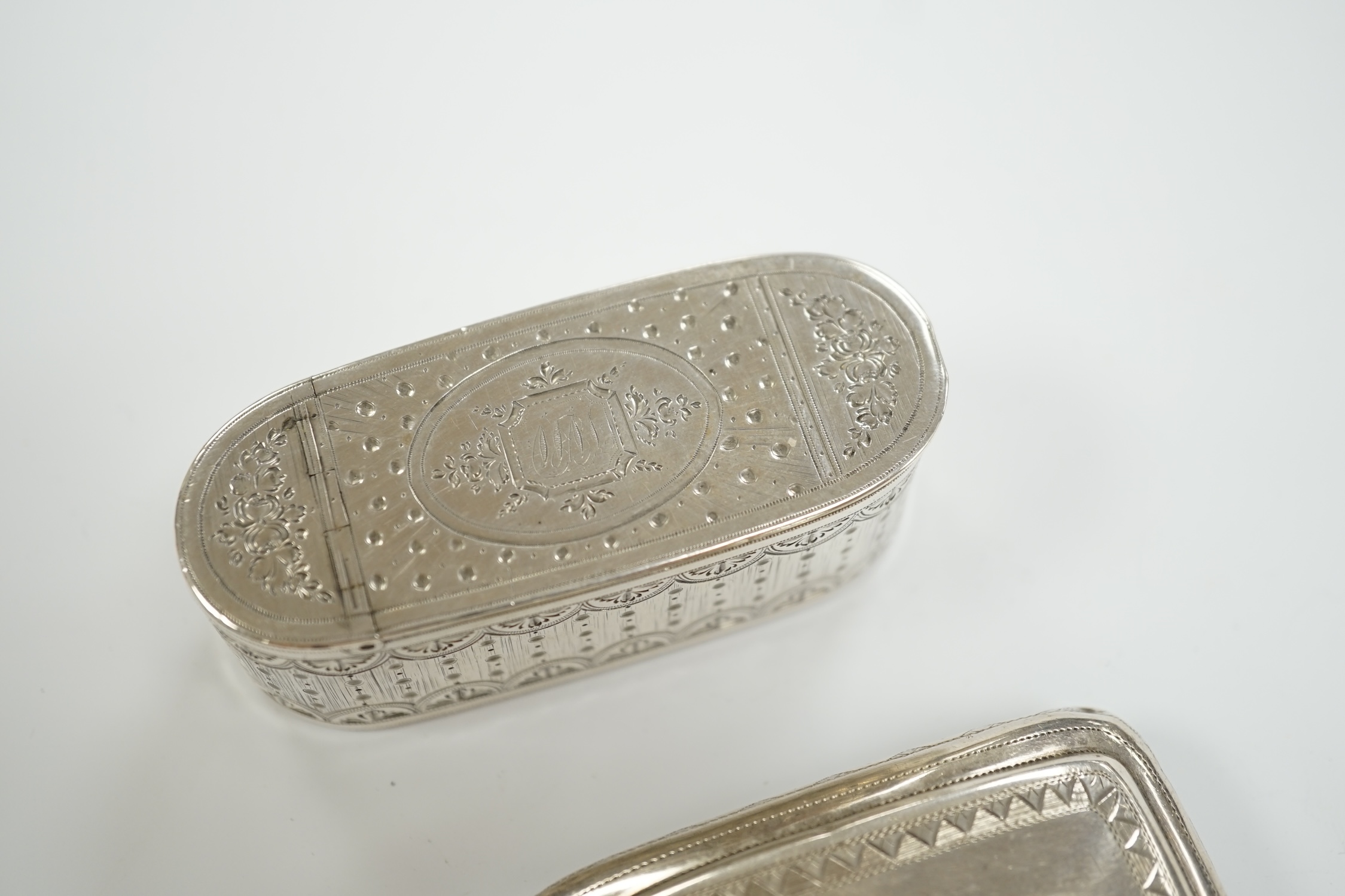 A George III engraved silver oval snuff box, by Phipps & Robinson, London, 1793, 70mm and one other Georgian silver snuff box.
